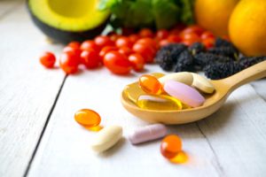 pharmaceutical pills, supplements, vitamins, fruit, whole food ingredients